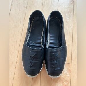 Yves Saint Laurent leather slip on espadrilles.